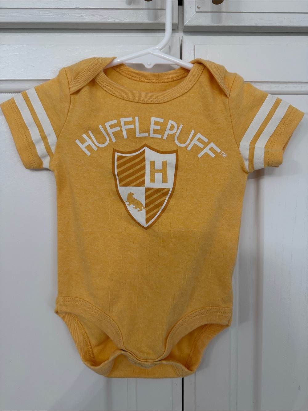 Warner Bros. Hufflepuff Yellow Baby Bodysuit with White Stripes